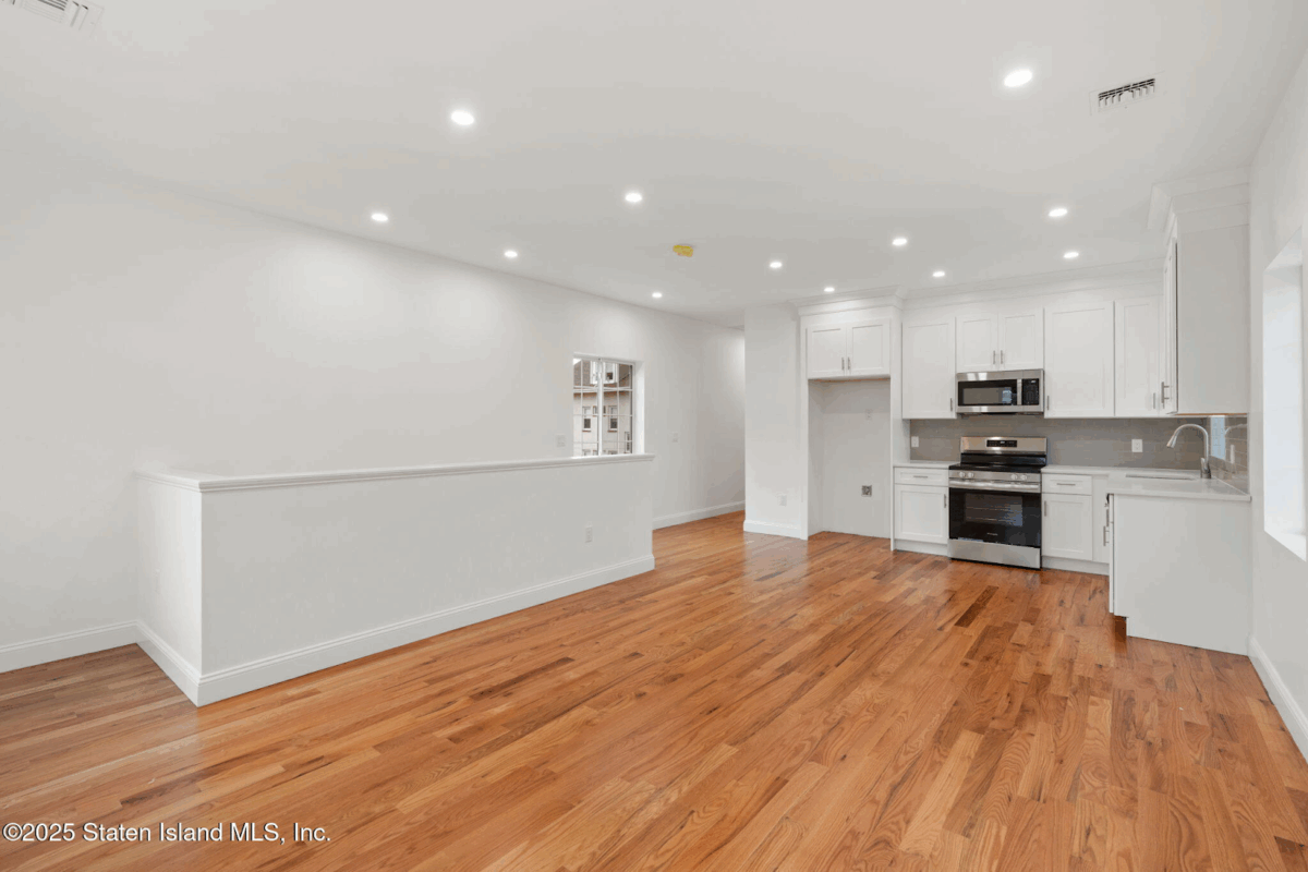 Modern owner’s duplex kitchen at 1380 Clove Road with quartz counters and stainless steel appliances.